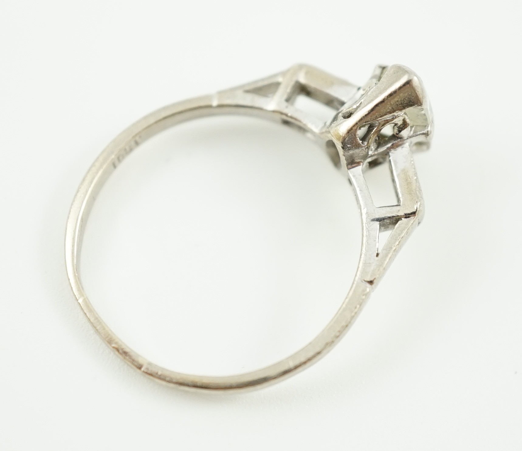 An 18ct white gold and single stone marquise cut diamond set ring, with baguette cut diamond set shoulders